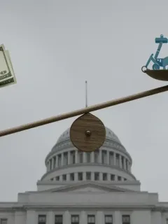 Illustration of the 2025 US Federal Budget balancing key spending areas like healthcare, defense, and climate.