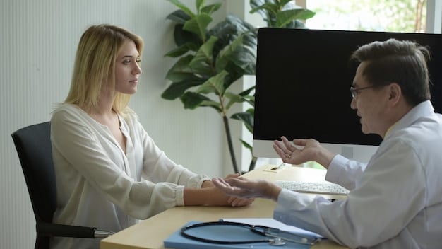 A doctor explaining health insurance coverage options to a patient in an office setting.