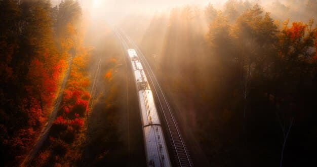 A high-speed train traveling through a scenic landscape, showcasing advancements in railway infrastructure and transportation.