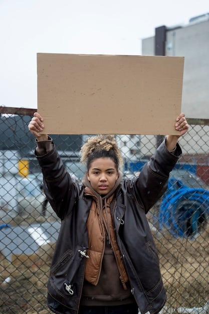 A protest outside the White House against the US government's refugee policies. The protesters are holding signs and banners with messages of support for refugees.