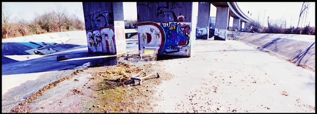 A divided panel showing successful aid projects on one side (e.g., a newly built school, a medical clinic) and failed projects on the other (e.g., unfinished infrastructure, abandoned equipment).