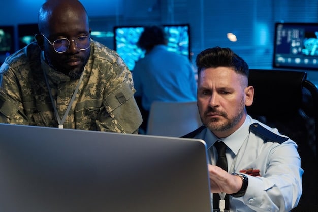 A close-up shot of a diverse team in a security operations center (SOC), monitoring a large screen displaying network traffic and security alerts, highlighting the vigilance required for compliance with SEC regulations.