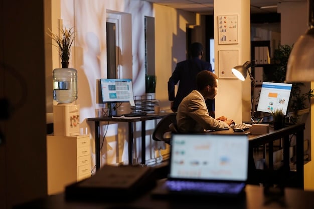 A person working on multiple computers in a modern, well-lit home office. The person is focused and appears to be coding or analyzing data. The environment suggests a high-tech, comfortable workspace.