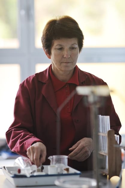 A close-up of a scientist working in a laboratory, surrounded by advanced equipment and solar cell prototypes. The scene is brightly lit, emphasizing the precision and innovation involved in renewable energy research.